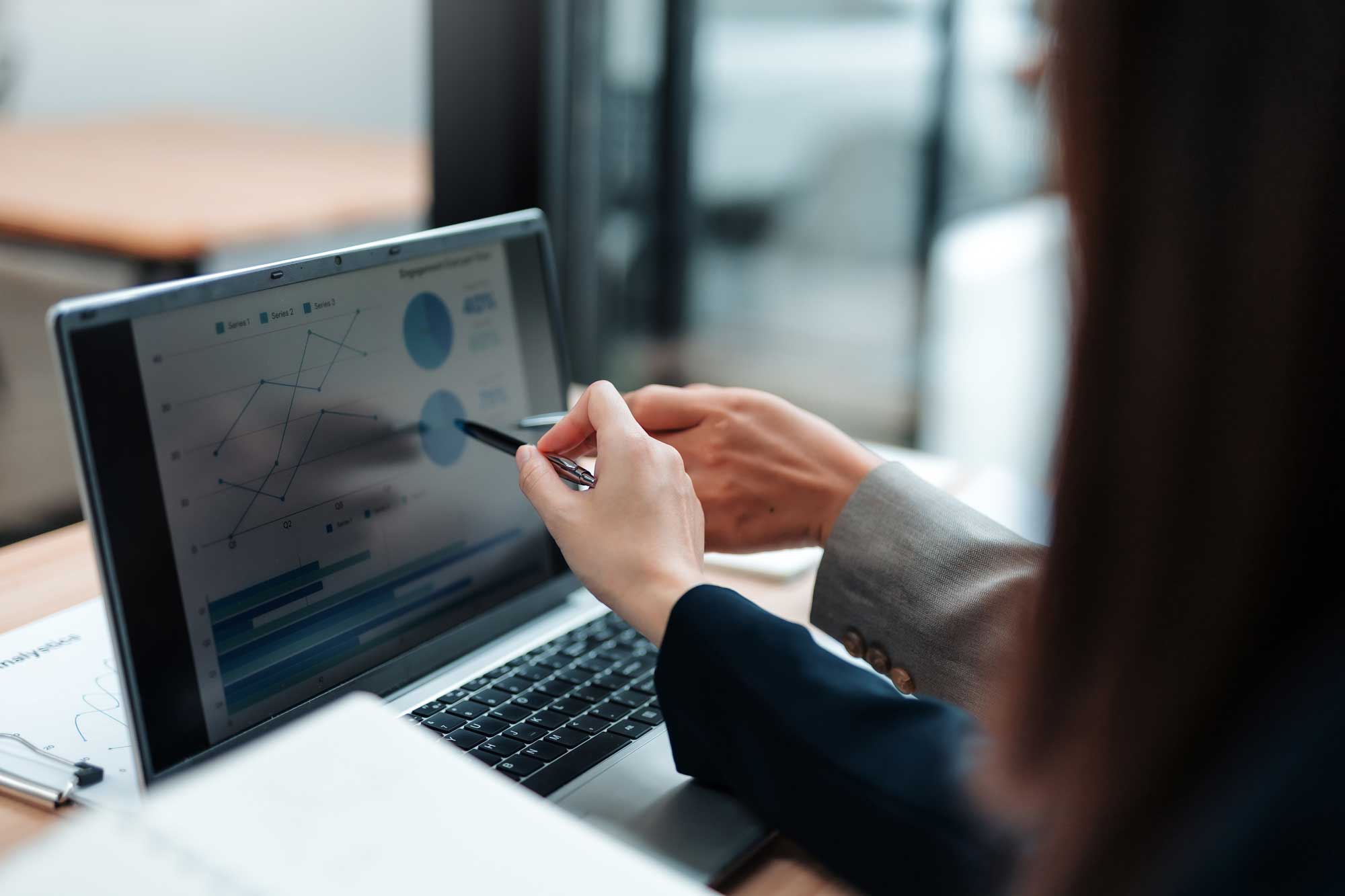 Financial professionals looking at computer